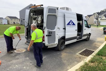 Sewer Inspection Team At Manhole